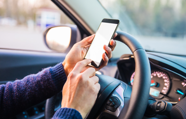 Holding a phone while driving