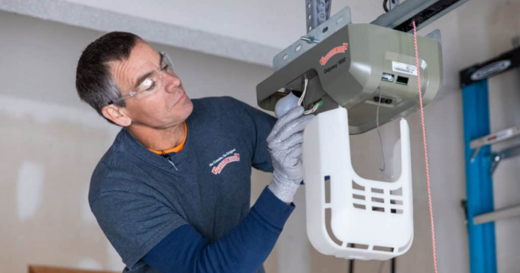 Technician installs an Overhead Door opener.